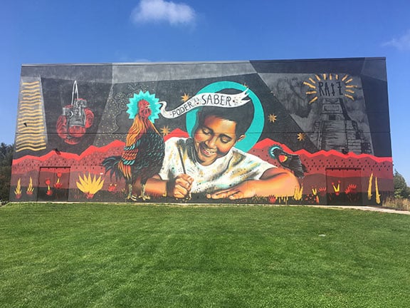 Colorful mural at Rodarte Community Center, featuring cultural and artistic elements.