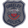 Detailed emblem representing the Greeley Police Department, showcasing its motto and logo.