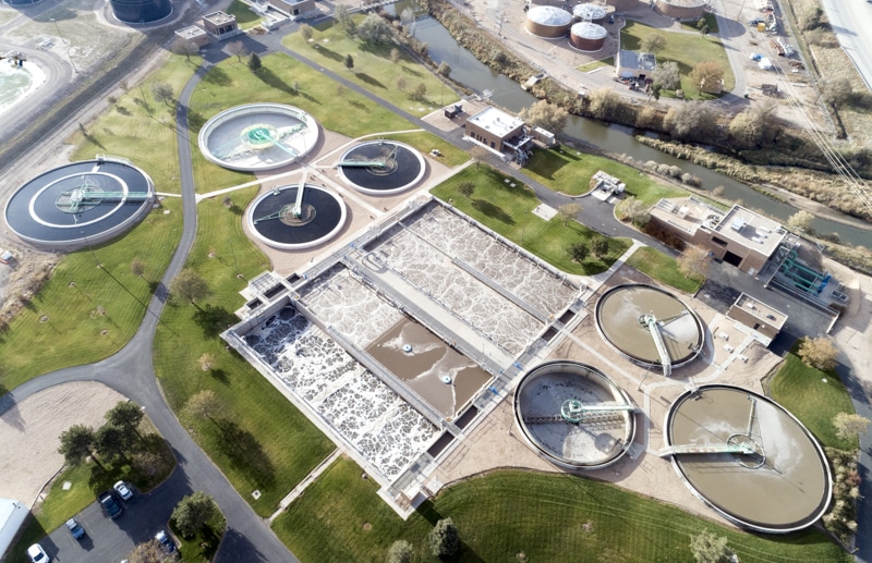 An aerial perspective showcasing the Greeley Colorado water treatment facility surrounded by green landscapes and infrastructure.