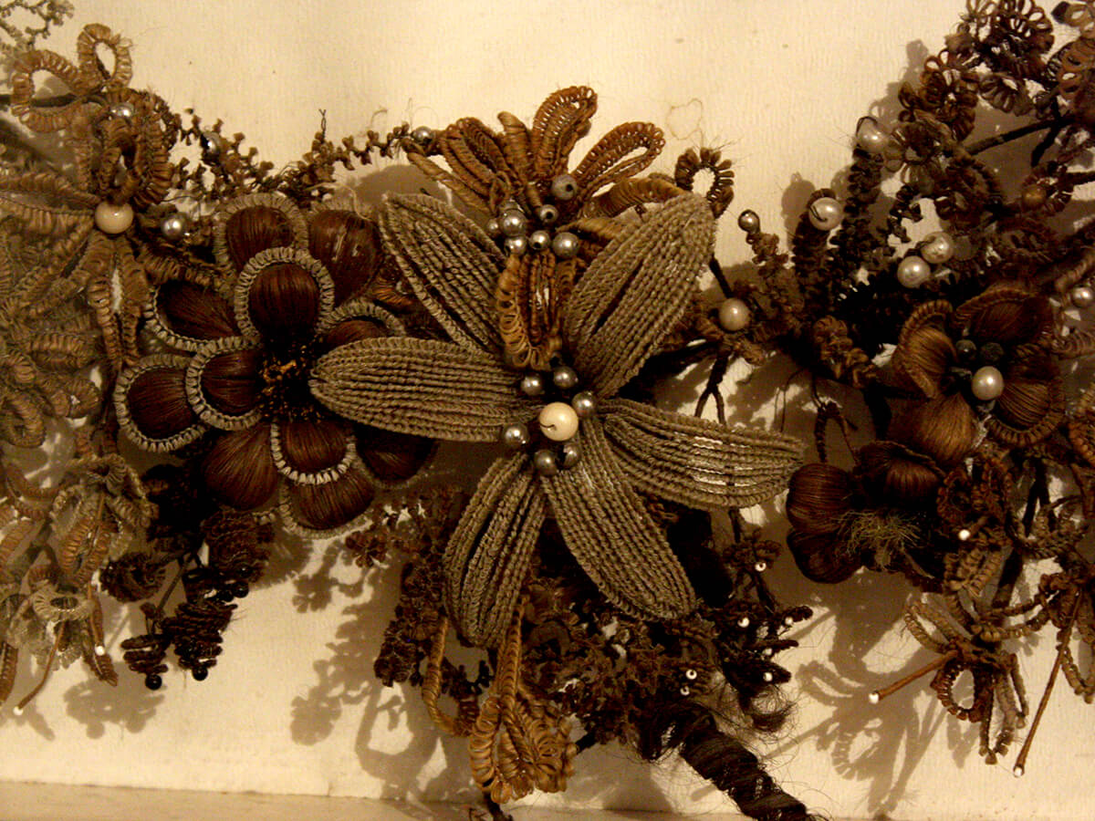 Closeup of floral embroidery resembling a wreath