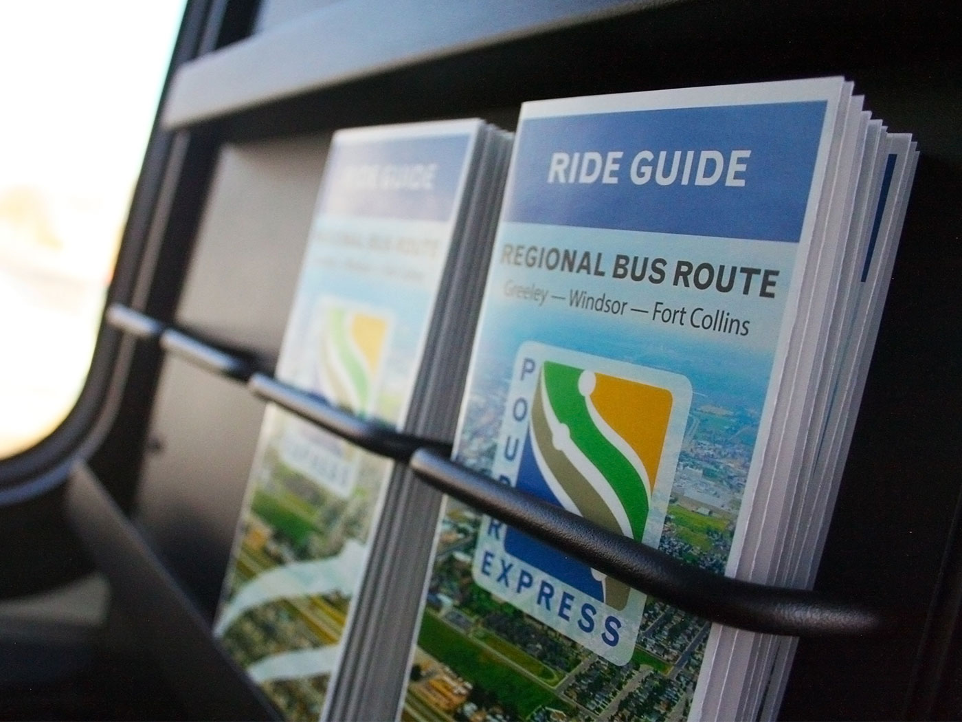 GET Ride Guide brochures stacked neatly in a display
