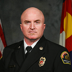 Greeley Fire Department officer pictured in official attire.