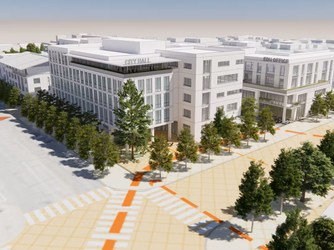 Artist's rendering of planned Downtown Civic Campus buildings.  Two four-story buildings are shown in the foreground and at the intersection of two tree-lined streets.  Behind those building are additional city buildings and blocks, all created as an artist rendering.  All buildings are white in color.  