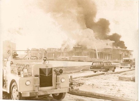 Historic image capturing the firefighters at the Michener Library during a large fire incident.