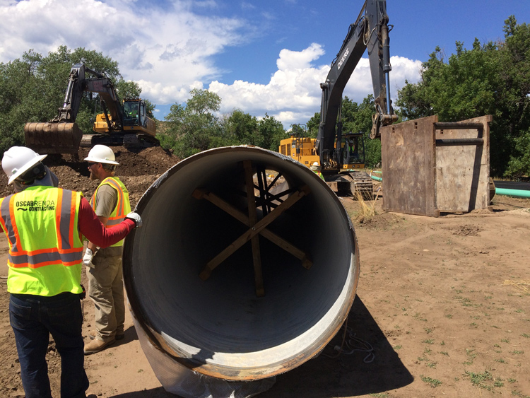 Workers and heavy machinery are engaged in constructing the Bellvue Pipeline, showcasing infrastructure development.