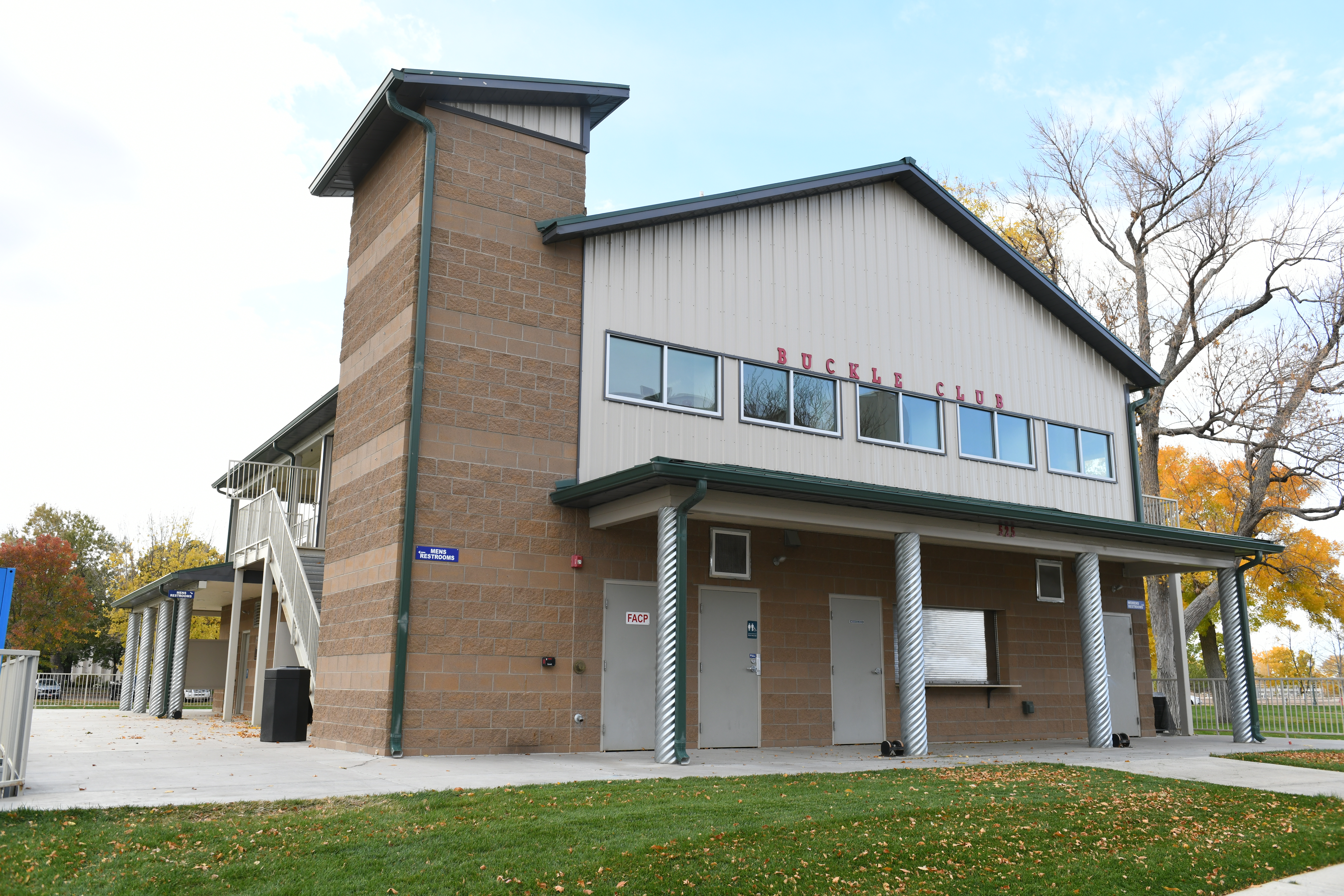 Exterior view of the front of the Buckle Club building and signage