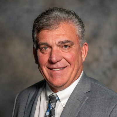 Professional portrait of councilmember Johnny Olson