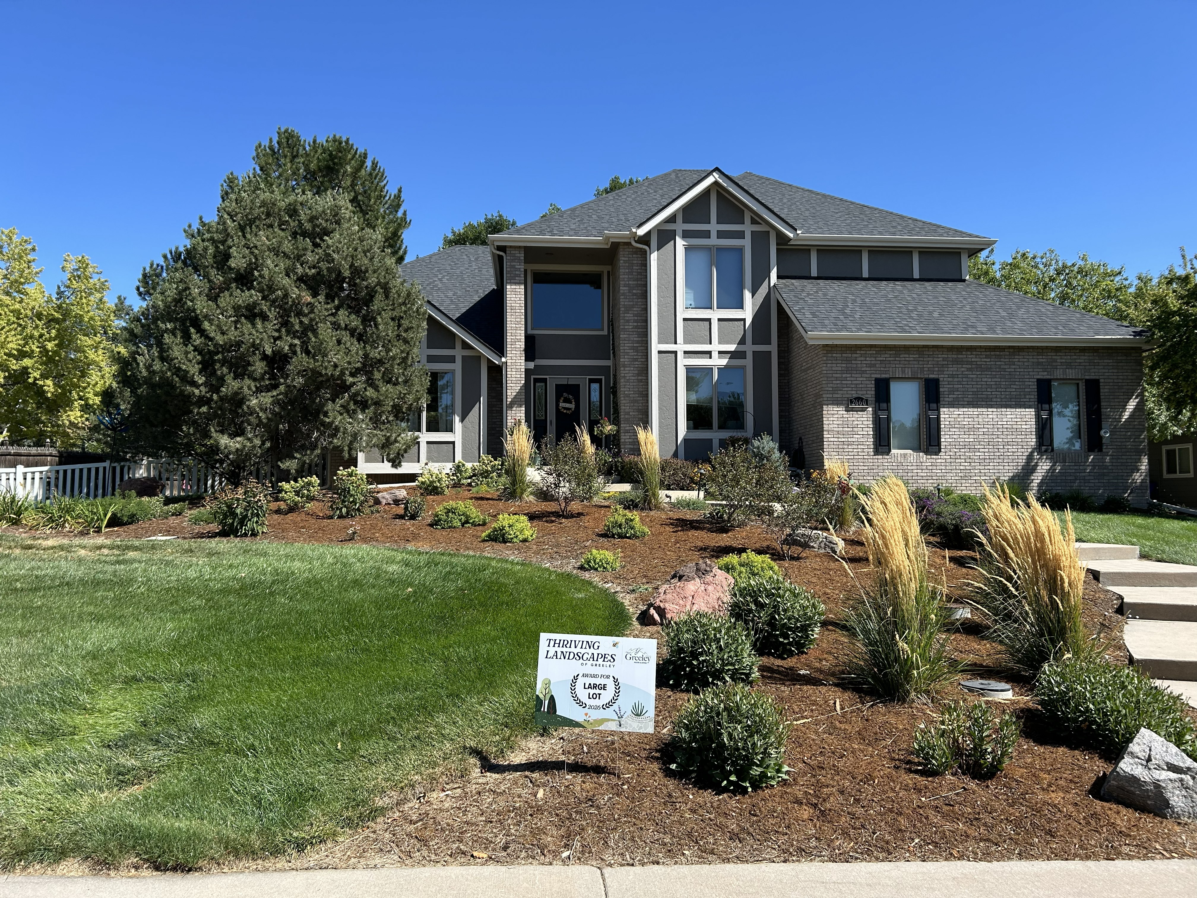 Home with a waterwise landscape.