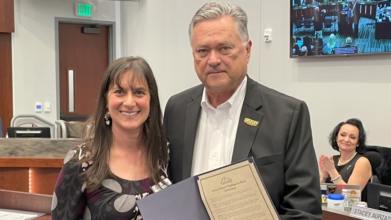 Mayor Pro Tem Dale Hall presenting a proclamation to Dena Egenhoff, City of Greeley Water Conservation Manager.