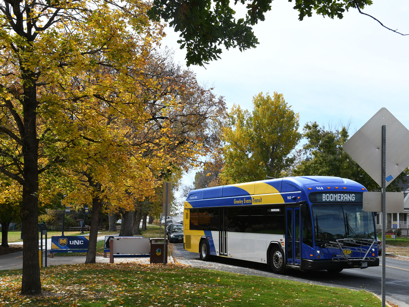 Bus displaying route signage for Boomerang and a UNC sign in the background