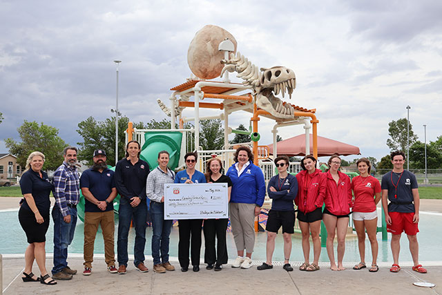 Phillips 66 staff present an oversized check for $20,000 to Greeley Recreation employees at Discovery Bay Waterpark
