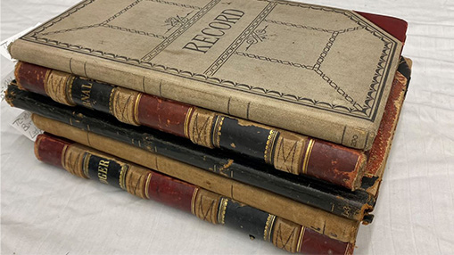 A collection of historic ledgers from Dearfield preserved for study and research.