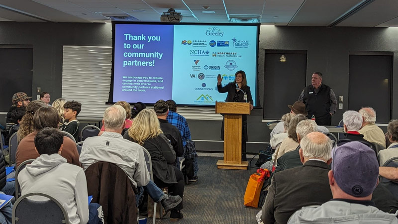 Assistant City Manager Juliana Kitten and Mayor John Gates addressing a crowd during the January 2024 Community Update.