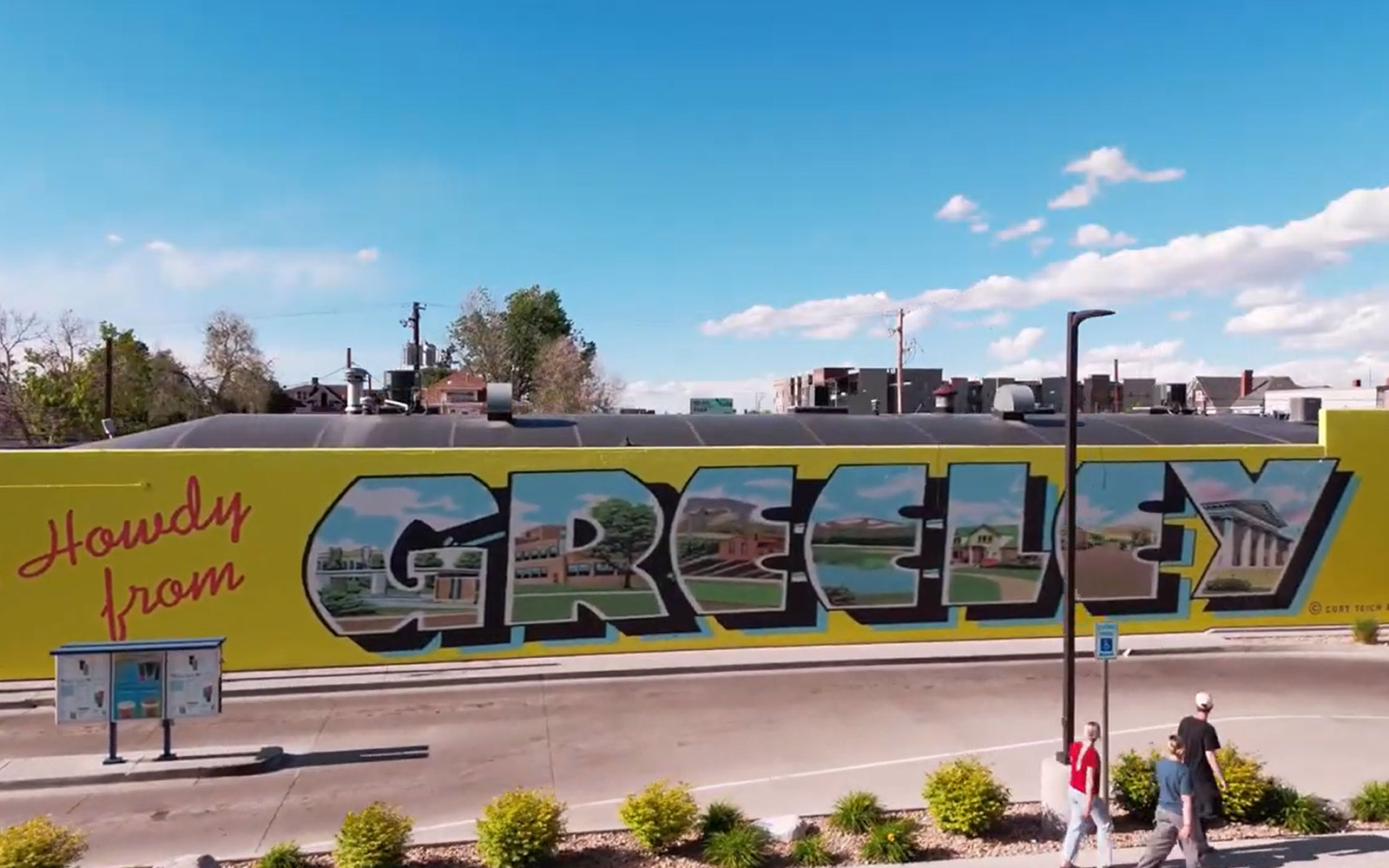 Aerial photo of a building mural that reads Howdy from Greeley