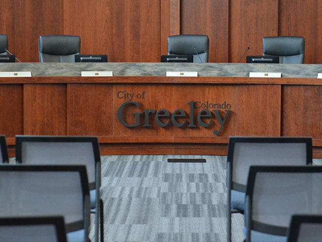 Empty seats in the Greeley Council Chambers