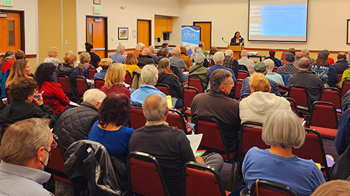 Residents attending a workshop focused on managing Homeowners Associations in a community setting.