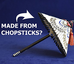 A unique umbrella crafted from repurposed chopsticks demonstrates innovative sustainability practices.