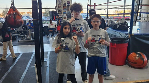 Participants at the Rodarte Boxing Club display their accomplishments from the Silver Gloves competition.