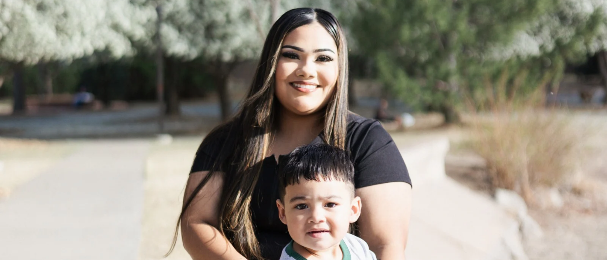 One of Hope House Northern Colorado's teen mom and son sitting together smiling that have been a part of their program.
