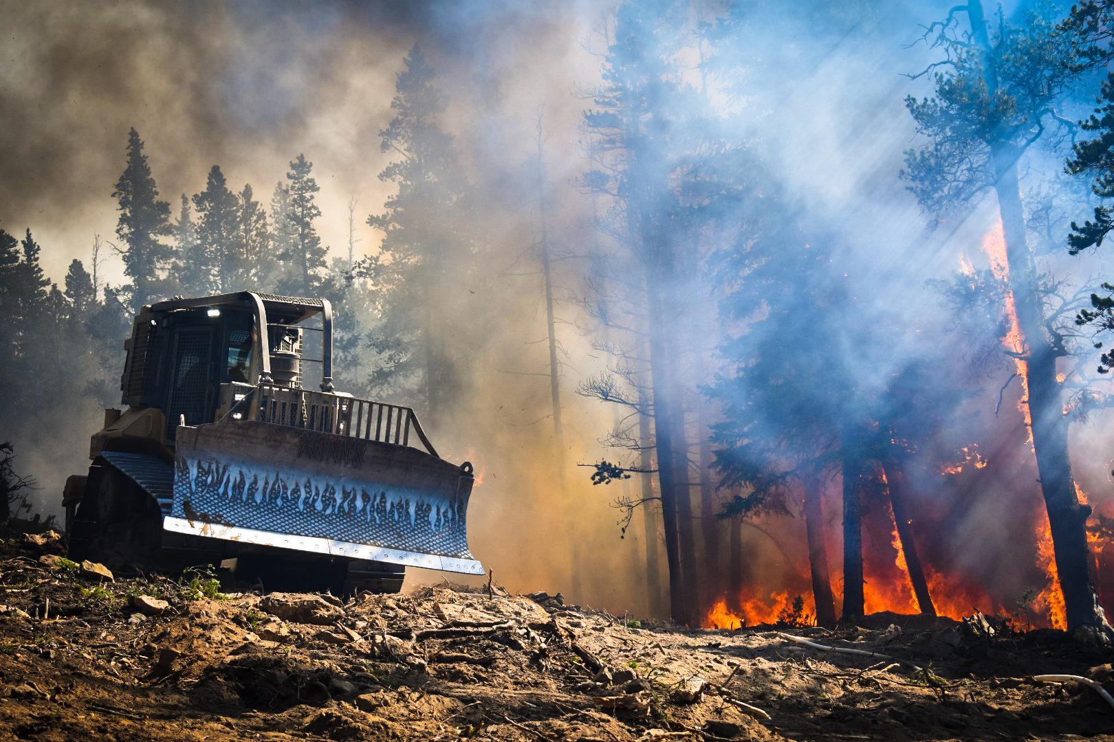 a Wildfire happening and people work to stop the fire.

Photo credit: Coalition for the Poudre River Watershed