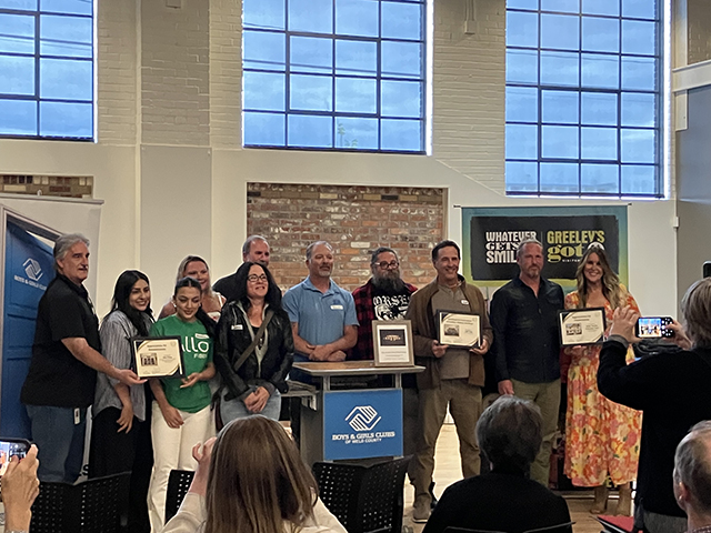 2025 winners pose for a group photo with their awards at the Historic Preservation Month event