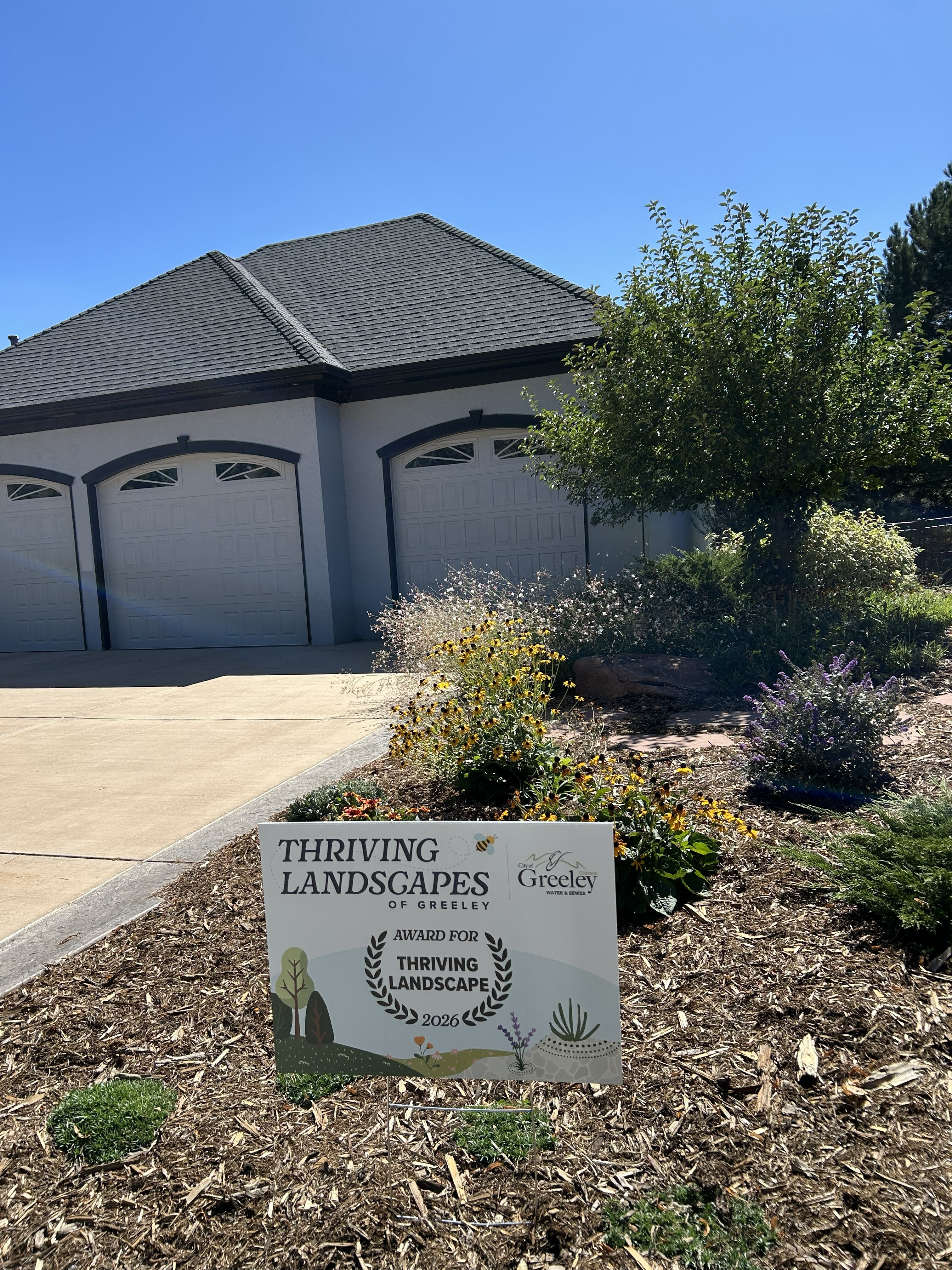 Home with a waterwise landscape.