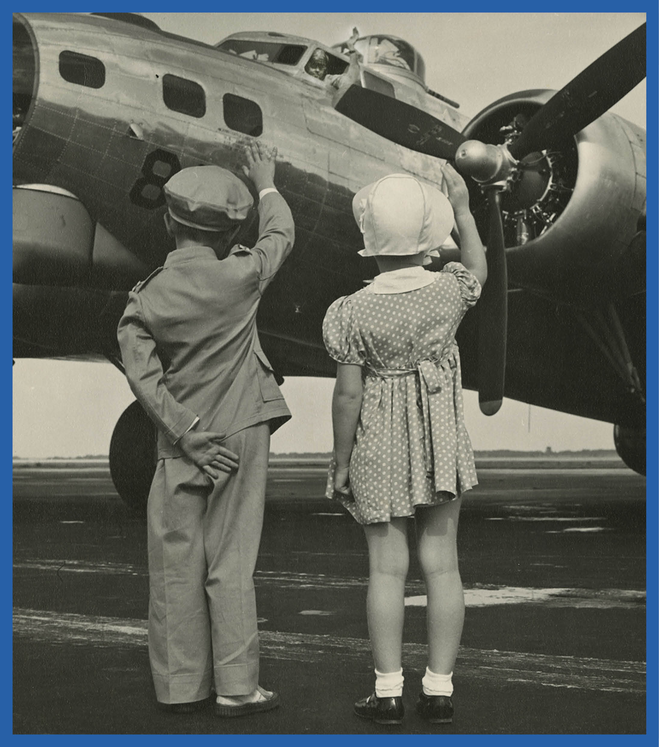 Children waving an airplane