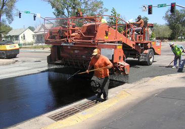 Workers engaged in roadwork as part of Greeley’s infrastructure improvement program.